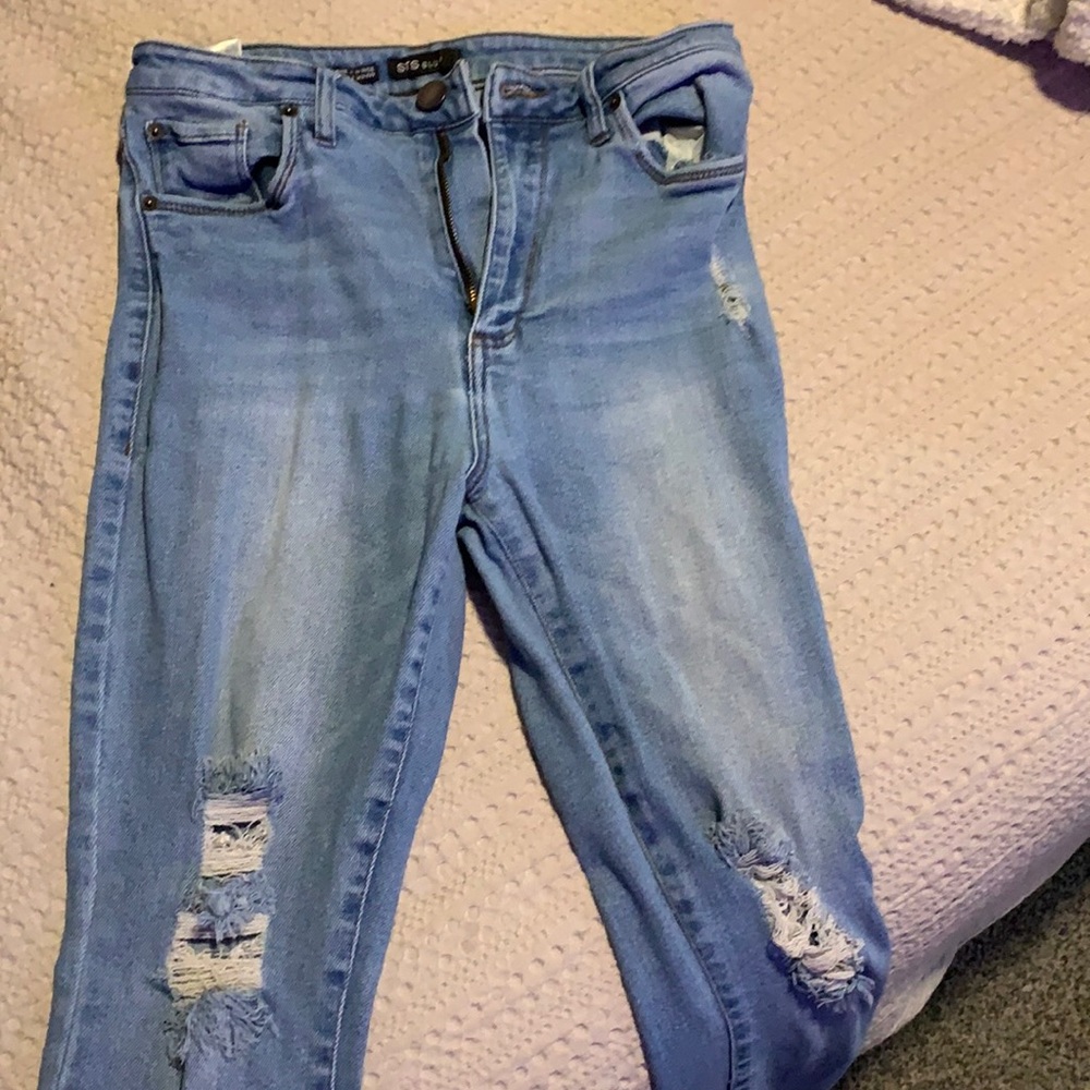 Light wash distressed high rise skinny jeans